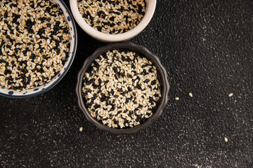 Sesame spice mix white and black tasty fresh gourmet food background on table rustic food top view copy space keto and paleo diet vegetarian and vegan food