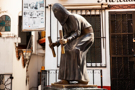 Taxco, Mexico - November 18, 2024: Monument to the traditional Holy Week processions at the beautiful Magical Town of Taxco de Alarcon. Penitent souls.