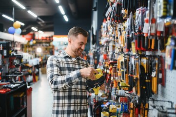 Portrait of mature man standing in hardware store
