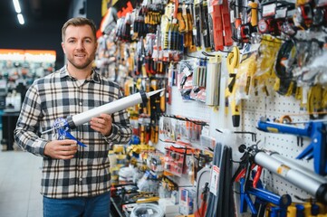 Young man working in hardware store