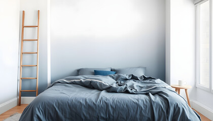 Fototapeta premium Grey and blue bedding on bed against ombre wall in minimal bedroom interior with ladder. White tone