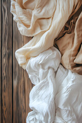 Pristine Order: Aerial View of Freshly Folded Laundry on Wooden Table