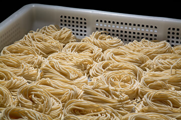 raw pasta on white background
