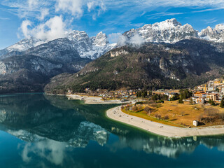 Aerial drone view of Lake Molveno, beautiful lake in Italy. Lake in dolomites from drone in winter....