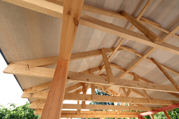 Unfinished frame house. Building process on construction site