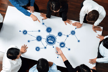 A dynamic office scene where a diverse team collaborates on data analysis with visuals on a white...
