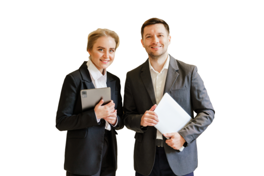 Business colleagues posing together in formal attire with digital devices in a bright environment