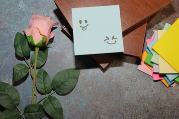 pink rose on a wooden background