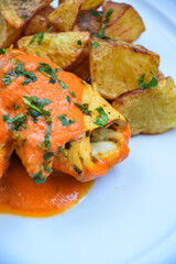 homemade recipe of chicken with cheese, potatoes and orange sauce