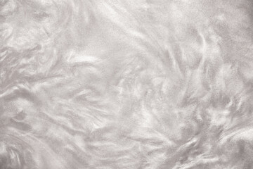 Shimmering silver abstract background. Liquid glitter paint texture waves and swirls. Beautiful...