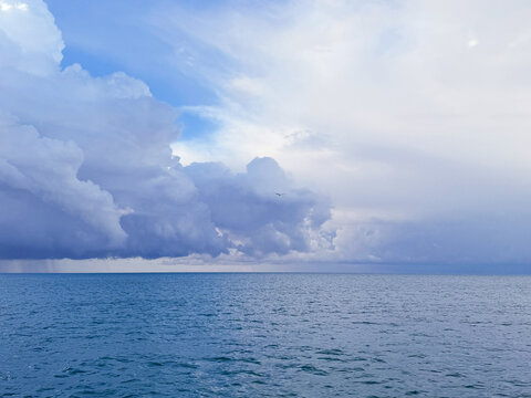 Cloudy sky over ocean before rain