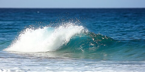Fototapeta premium Capturing the raw power and beauty of a wave crashing on the ocean surface