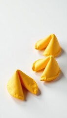 Fototapeta premium Three golden fortune cookies against a stark white backdrop , snack, lucky