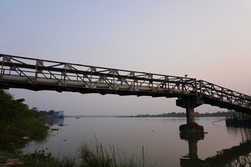 A pipeline bridge structure spanning across a river
