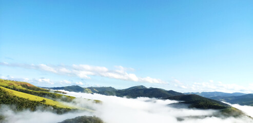 Fog in a dawn in a mountain landscape in the rural area of ​​Itabira, Minas Gerais, Brazil.