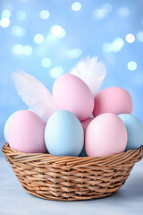 Pastel-colored eggs in a wicker basket, with delicate feathers