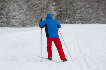 Cross-country skiing.A skier goes skiing in winter on a ski run.