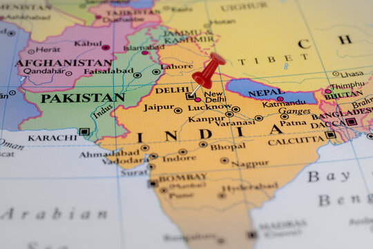 Colorful tourist location map with red stick pin at  Delhi, India, and the surrounding countries