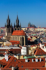 Gothic Church of Our Lady before Tyn with St. Vitus Cathedral and Prague Castle in background, Prague, Czech Republic, sunny day