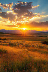 A breathtaking sunset over a serene landscape, with golden fields leading to distant mountains under a vibrant sky with dramatic clouds.