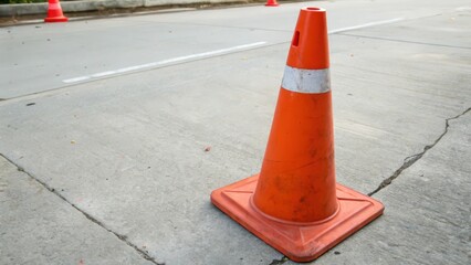 Orange Traffic Cone on Asphalt Road