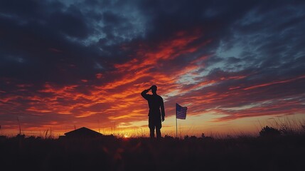 Fototapeta premium Silhouette Soldier Saluting American Flag Sunset
