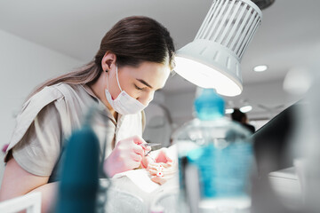Professional podiatrist or chiropodist working. Foot and toenails beauty and hygienic treatments.