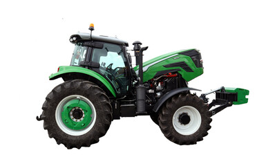 A bright green tractor stands ready for work in a farm environment under clear skies. Its robust build and powerful wheels indicate readiness for various farming activities.