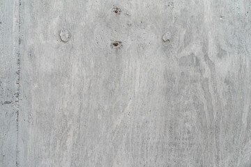 Cemento estructural con marcas de encofrado de madera, textura arquitectónica en alta calidad.