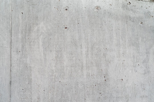 Textura de concreto con vetas de madera visibles, detalle r&uacute;stico en alta resoluci&oacute;n.