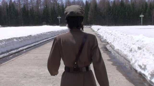 North Korean guide in military uniform in Grand Monument, Samjiyon, North Korea