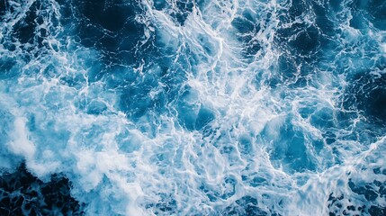 Fototapeta premium Waves Crashing in the Ocean Creating White Foam and Blue Water