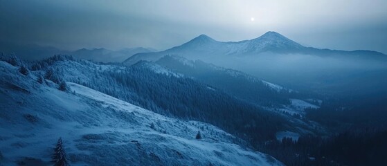 Obraz premium A mountain landscape with snow-covered peaks and a sunny sky, perfect for winter scenes or outdoor activities