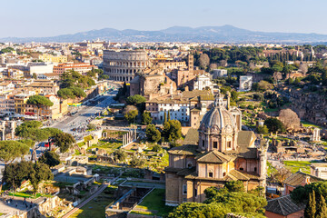 Rome skyline Roman Forum and Colosseum aerial view ancient historical temple ruins in Italy