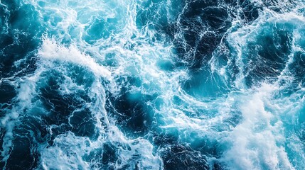 Obraz premium Aerial View of Ocean Waves Crashing with Frothy Whitecaps and Turquoise Water