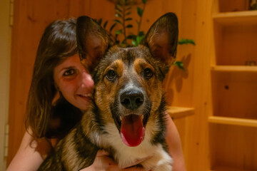 PORTRAIT, DOF: Cheerful Scottish Shepherd mix with a big, happy smile and a tongue sticking out to...