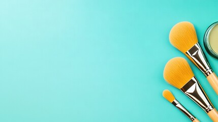   Three makeup brushes with a jar of cream on a blue background and copy space in the center