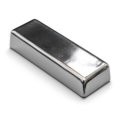 A rectangular bar of shiny polished metal reflects light resting on a white surface creating a strong contrast.