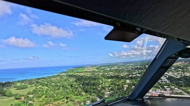 Approach and landing from Pilots point of view (POV) at Gregorio Luper&oacute;n International Airport, Puerto Plata, Dominican Republic - Cockpit View scenic landscape before landing  - aerial video footage 