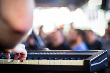 Close-Up of Musician's Hands Playing a Keyboard During a Live Performance
