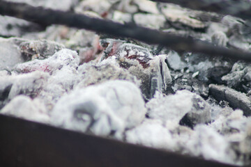 Closeup shot of a pile of charcoal with fire for a barbecue	
