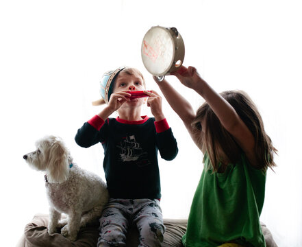Kids Playing Muscial Instruments with Dog