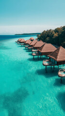 Obraz premium Luxuriöse Wasserbungalows stehen auf stilvollem Holsteg im klaren Meer