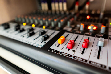 Mixing table in a music studio. © GraysonStock