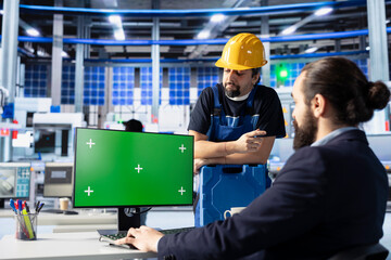 Photovoltaics factory engineering team using green screen PC to improve solar panels assembly...