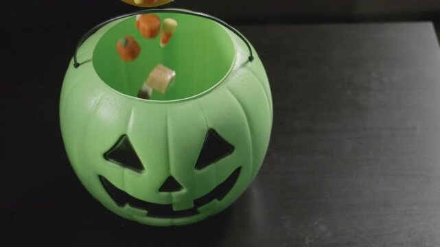 Pouring Halloweed Candy in Slow Motion