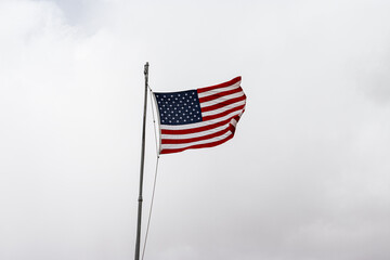 Obraz premium American flag flying at Petrified Forest National Park.