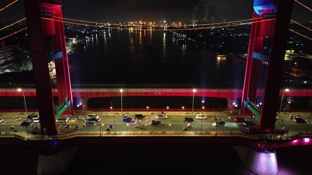 Aerial shot of Ampera Bridge at night, one of the landmarks of Palembang city, South Sumatra, Indonesia