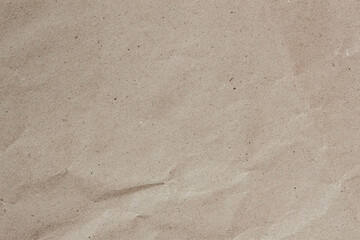 Crumpled kraft paper texture with visible creases and fibers. Natural organic background. Wrinkled paper. Recyclable material, texture, vintage cardboard