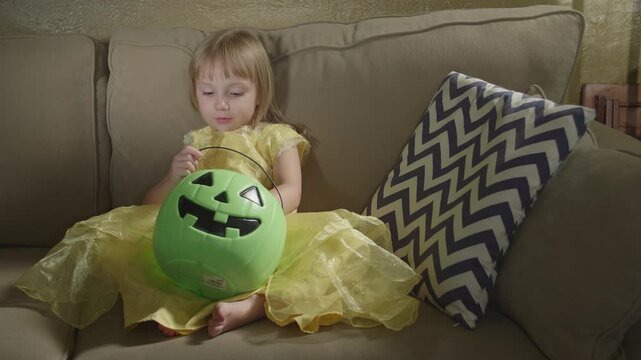 Little Girl Enjoying Halloween Candy
